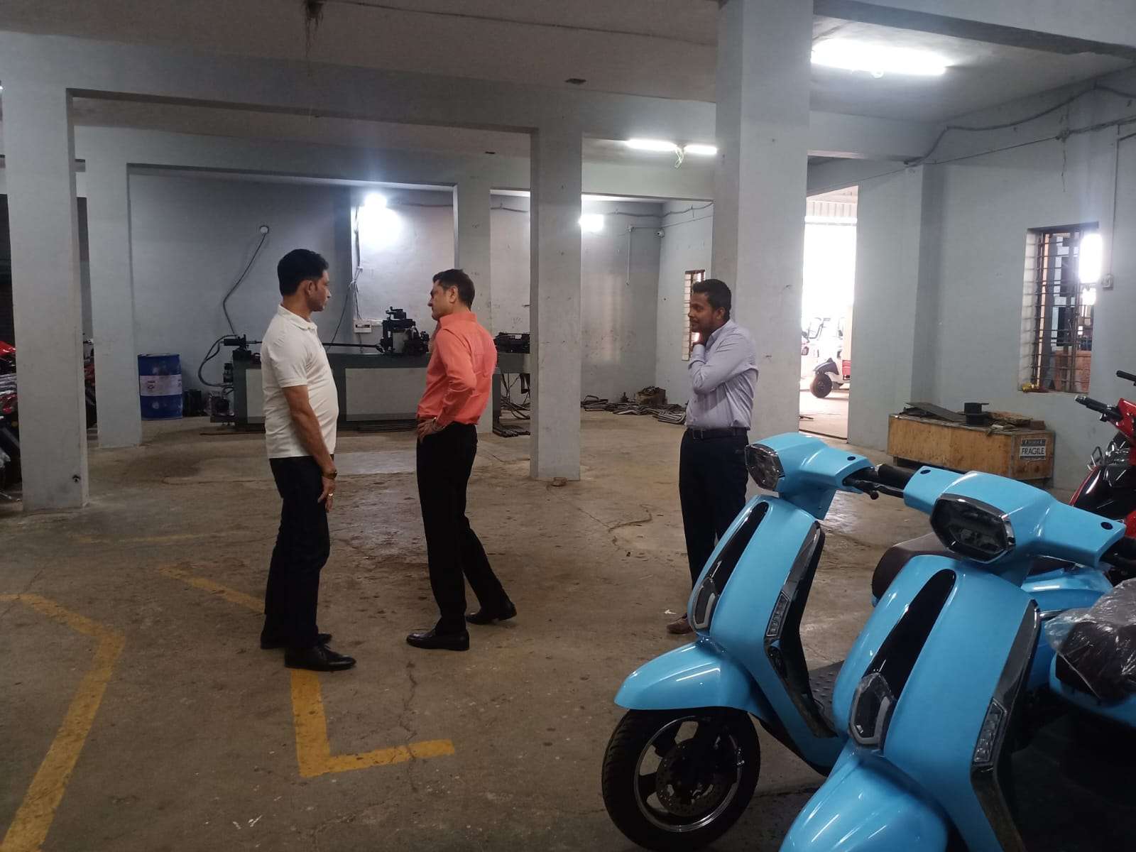 An early Mercury electric scooter on the floor