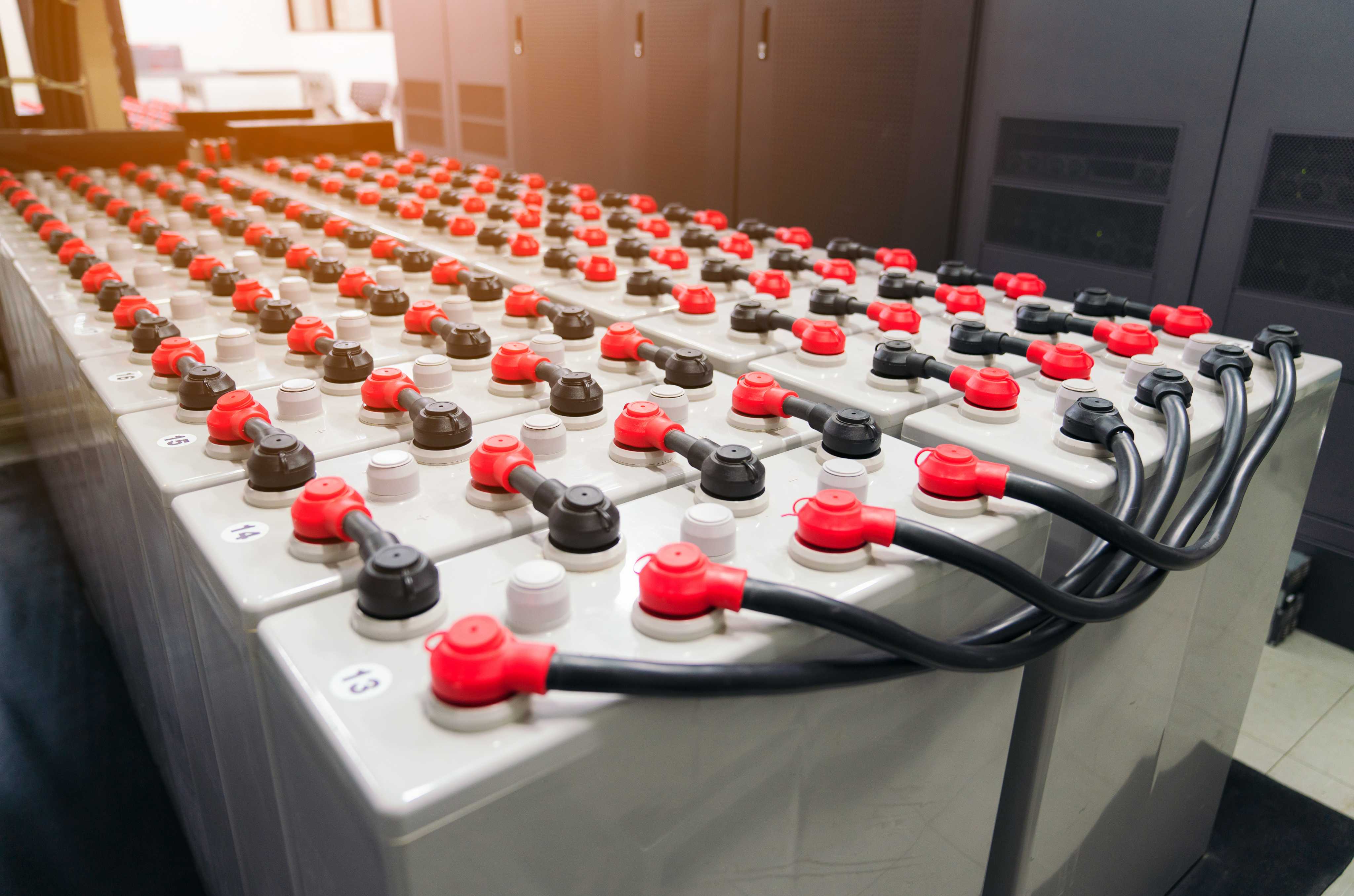 Mercury battery management system modules arranged in rows on a production floor.