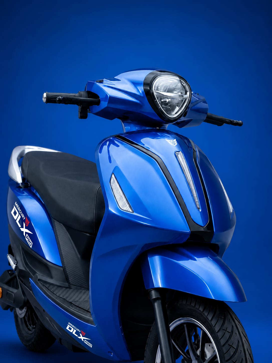 LED headlamp and front apron on the blue Mercury DLX PRO electric scooter
