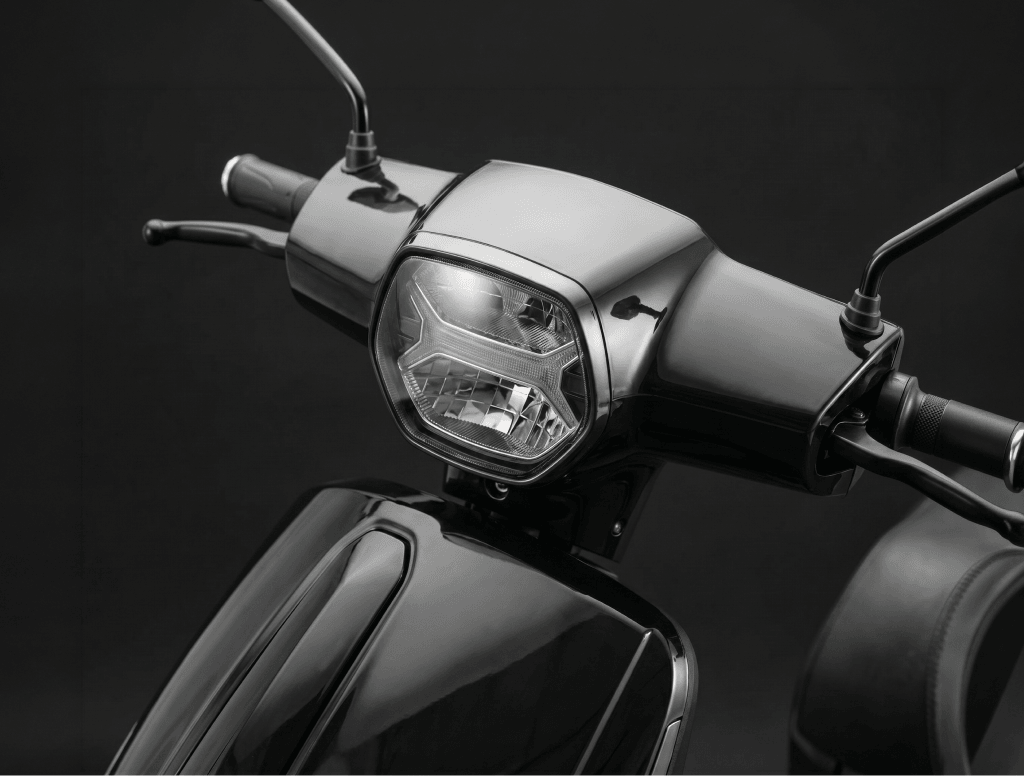 LED headlamp and handlebar controls on the Mercury DLX electric scooter