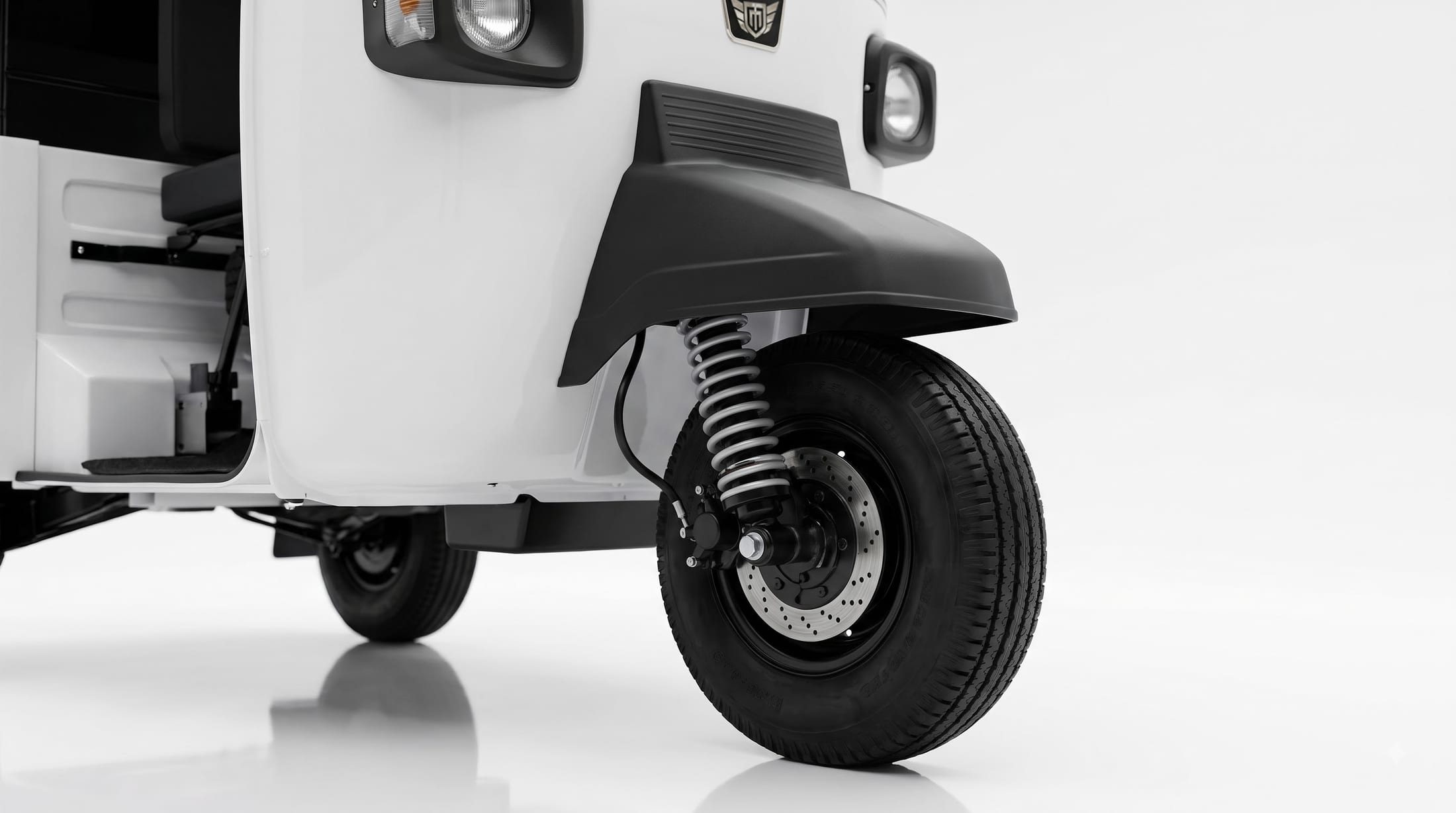 Front disc brake and coil suspension on the Mercury Limosa electric passenger auto