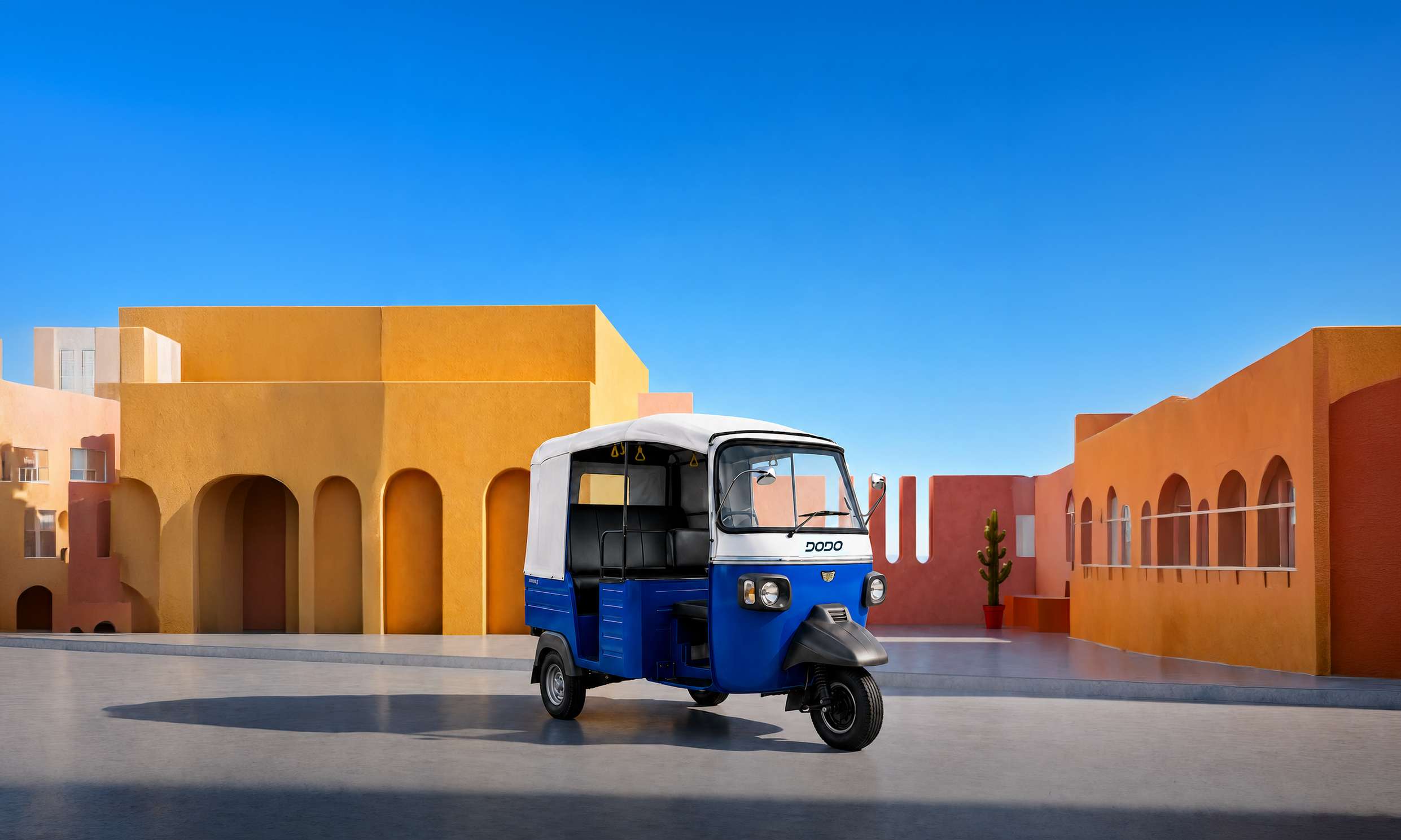 Mercury Dodo electric auto parked in a sunlit courtyard with ochre architecture.